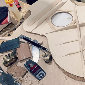 Guitar tools and wood on a workbench