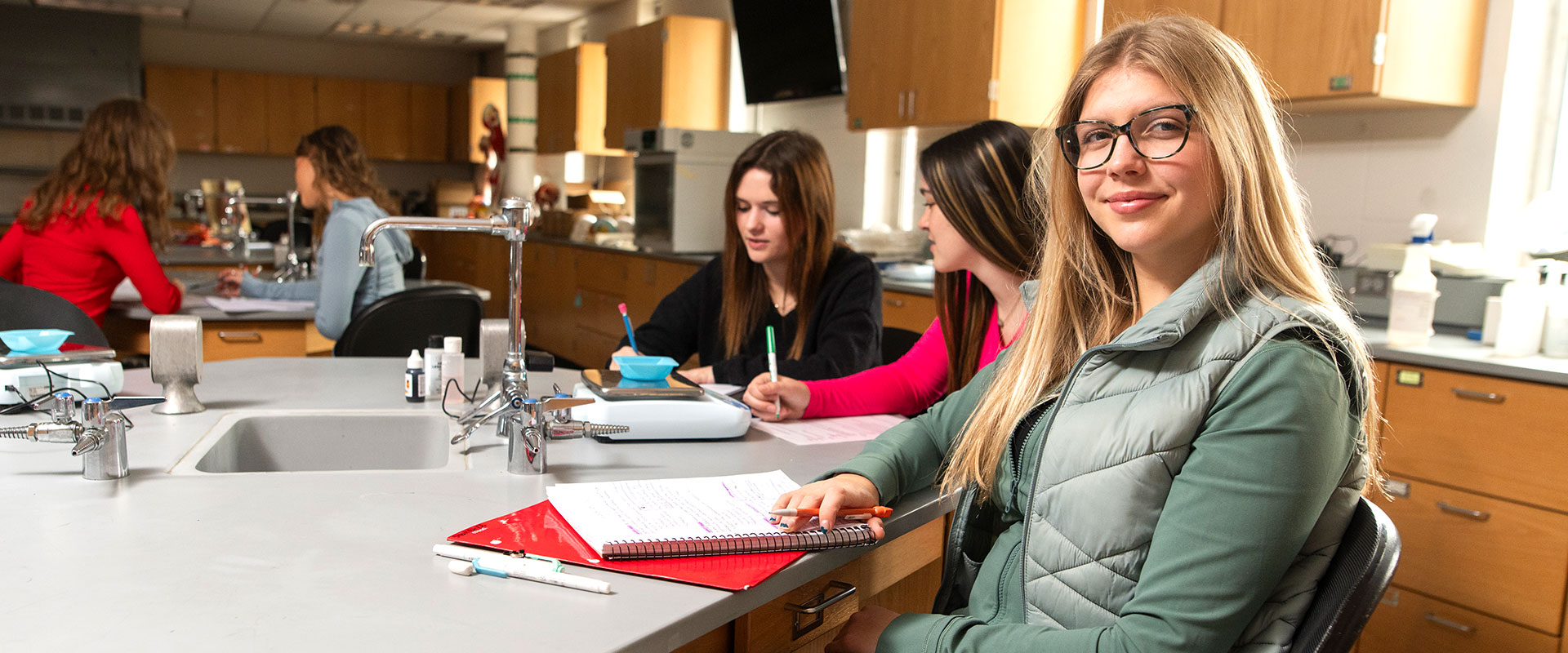 Female students in a science lab