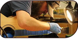 Student working on a guitar