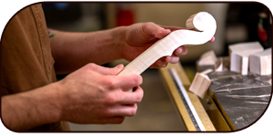 Hands holding part of a violin