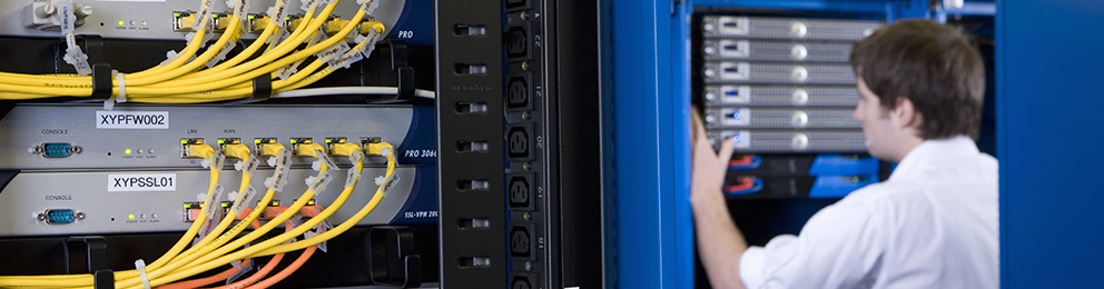 Technician working on a server rack