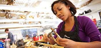 Student Working on Brass Instrument