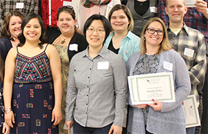 Several scholarship winners smiling at the camera